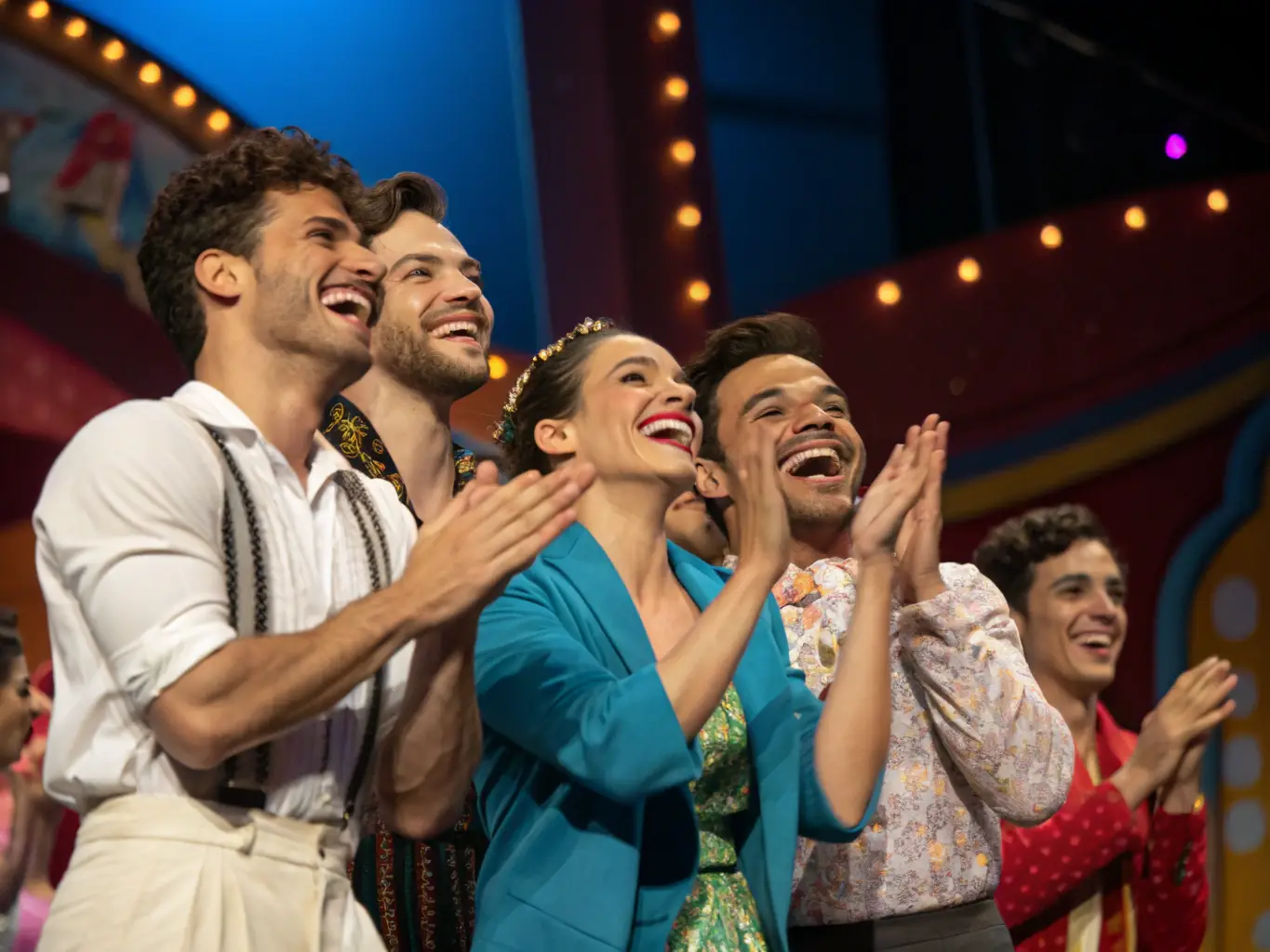 A dynamic image of the cast and crew of La Pirouette Théâtre taking a bow after a performance, with the audience applauding enthusiastically and the theater filled with a sense of community and appreciation.